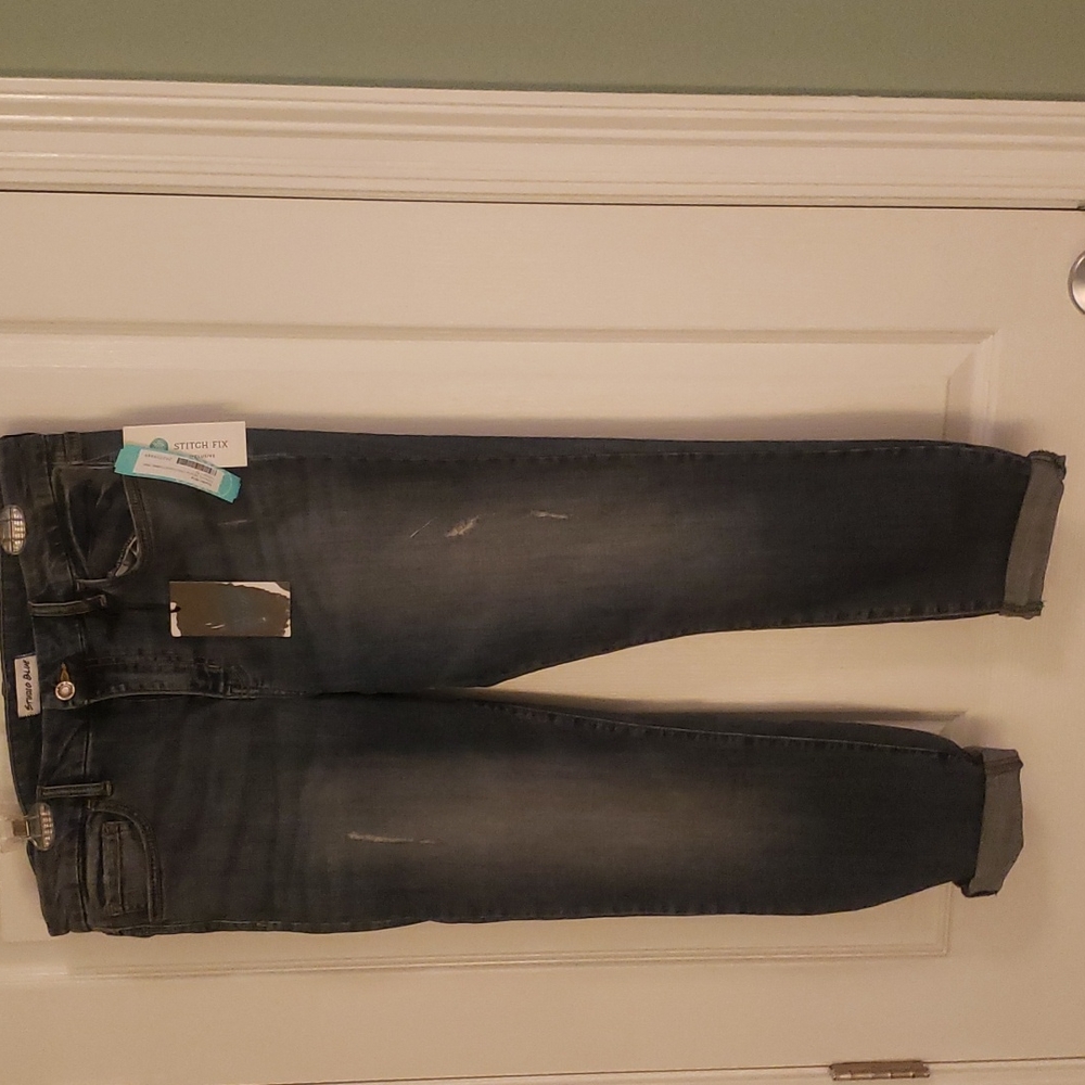 Skinny distressed rolled jeans